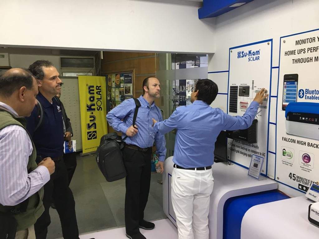 Kunwer Sachdev demonstrating Su-Kam solar products to international partners
